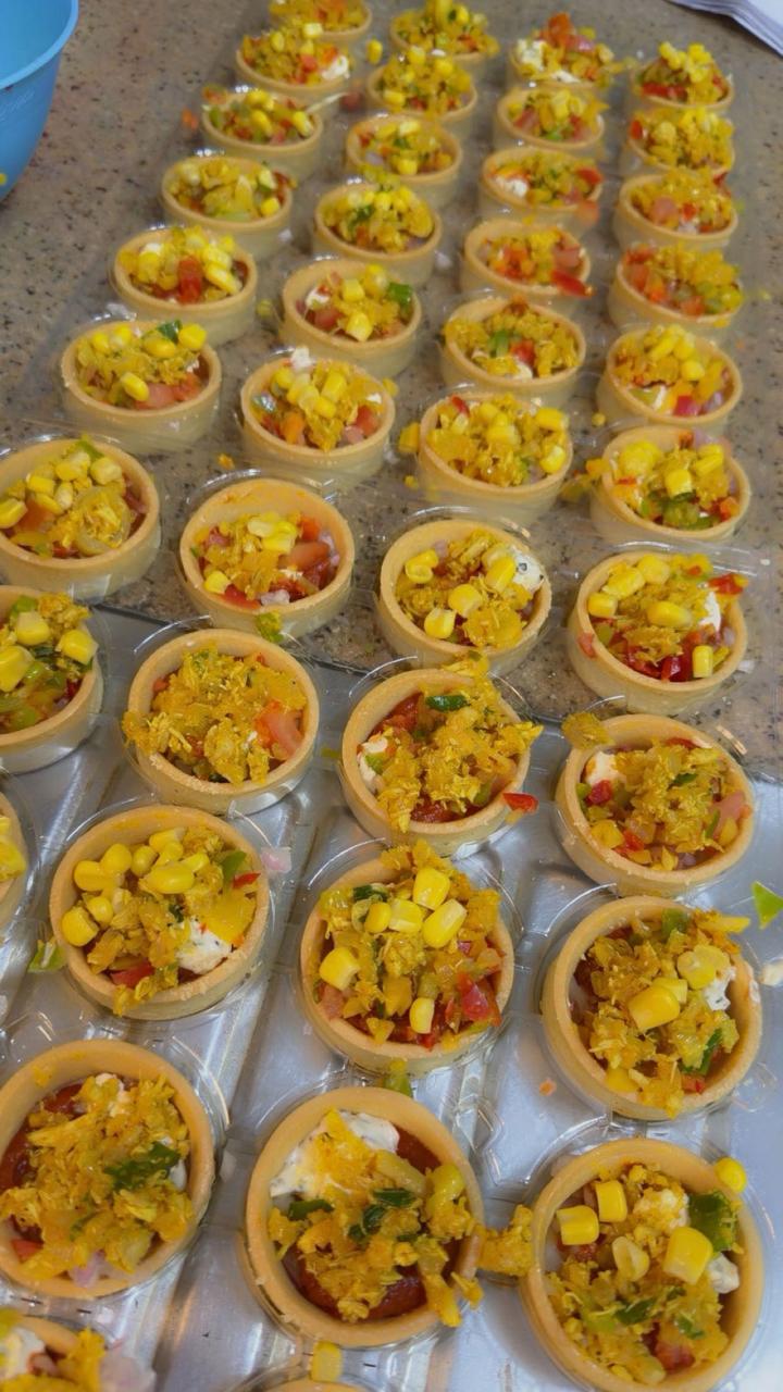 Freshly baked mini savory tarts with corn and vegetables from Zara Cakes Riyadh
