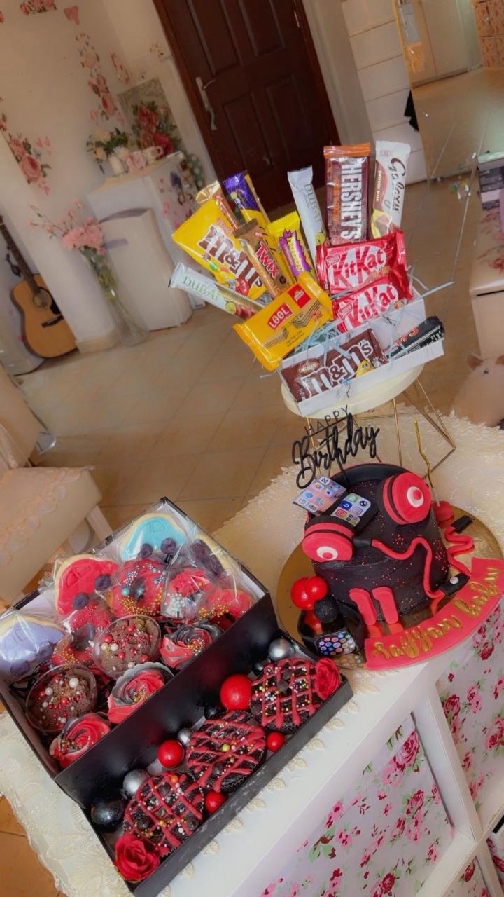 Gamer themed birthday cake with candy bouquet and chocolate gift box from Zara Cakes Riyadh