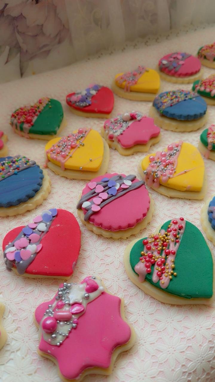 Colorful decorated sugar cookies with fondant and sprinkles from Zara Cakes & Bakes Riyadh